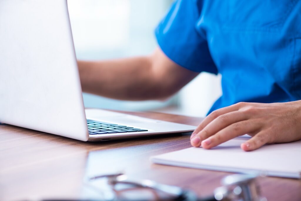 Practice administrator calculating lost revenue from patient dropout caused by a poor telehealth platform