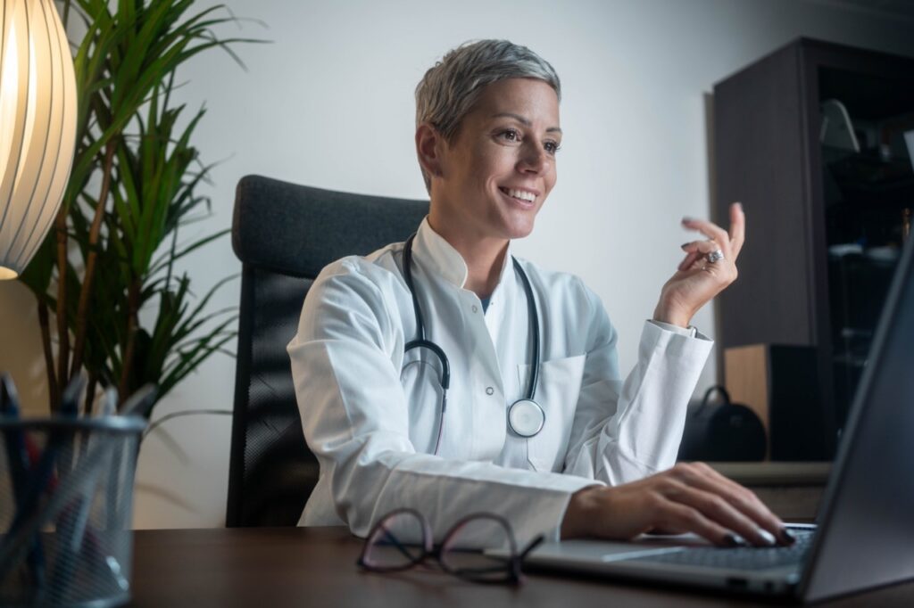Provider reviewing remote patient monitoring data during a telehealth visit